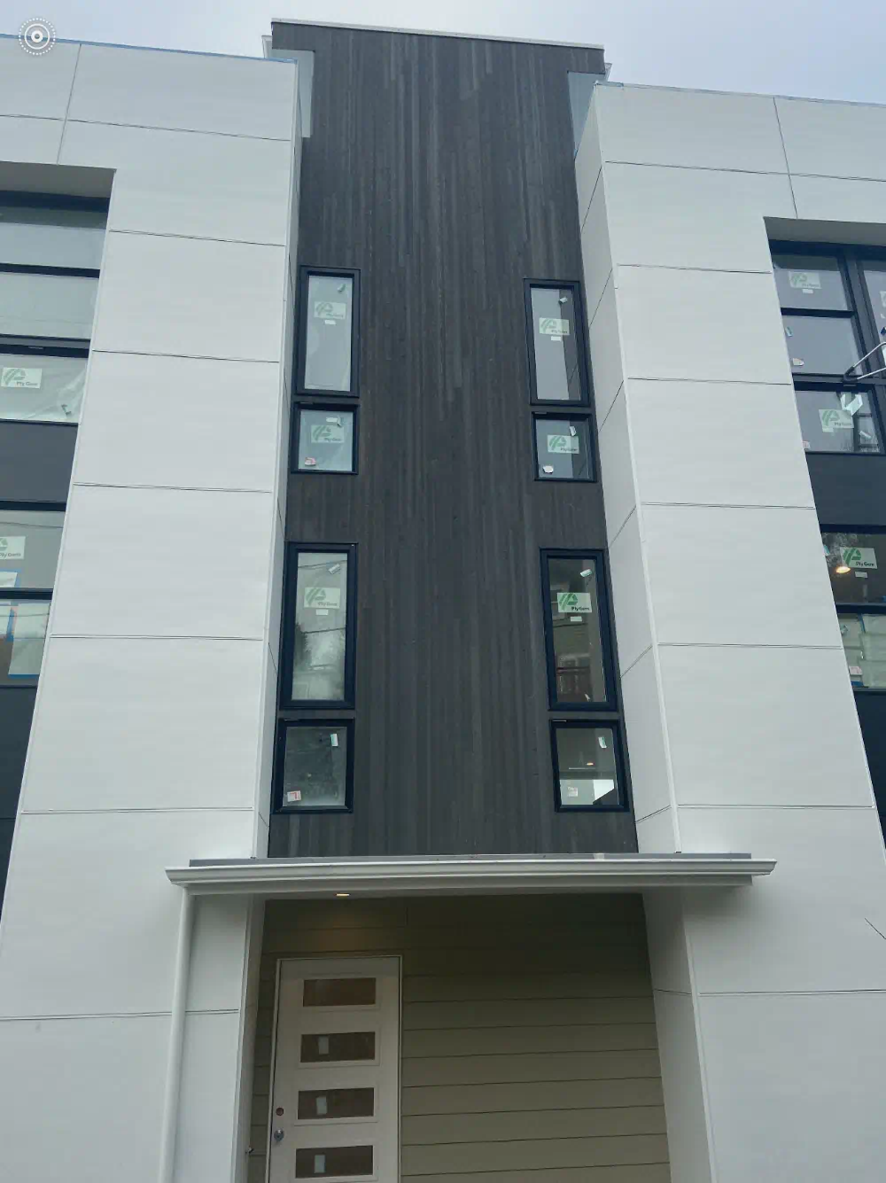 Finished siding and exterior trim on a Seattle-area building (photo 3 of 6)